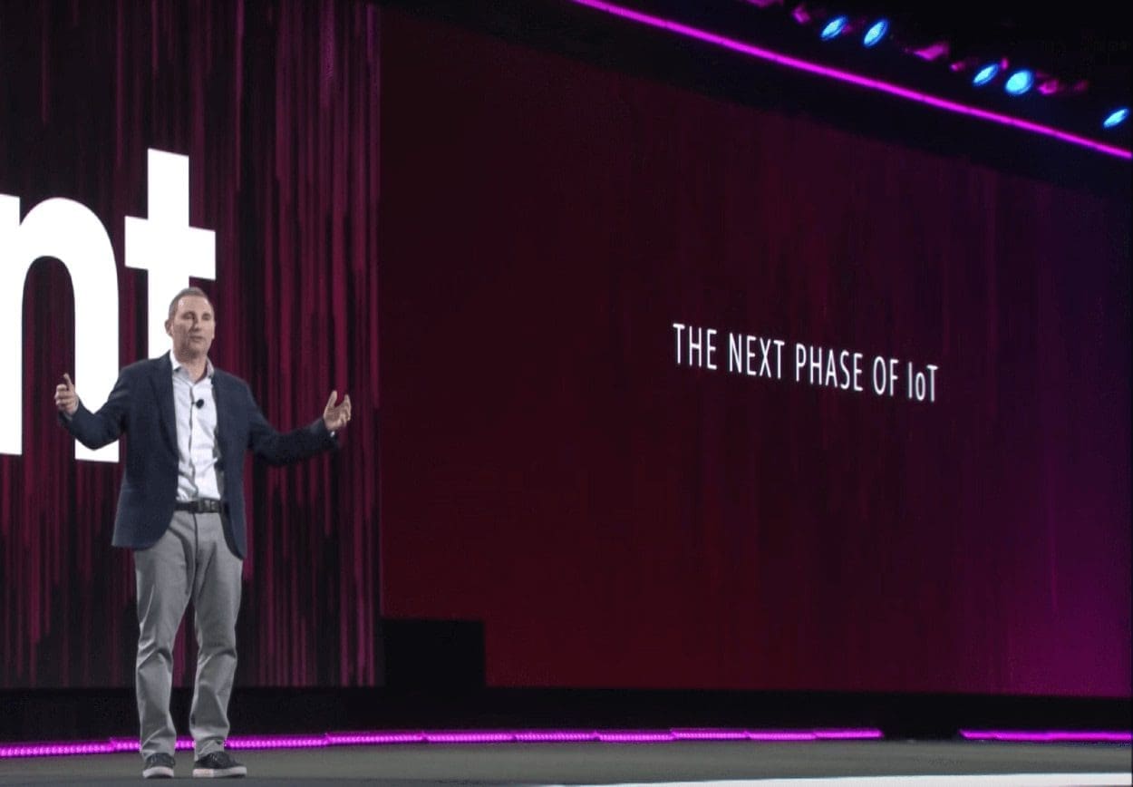 AWS ReInvent conference speaker on stage talking about the next phase of IoT